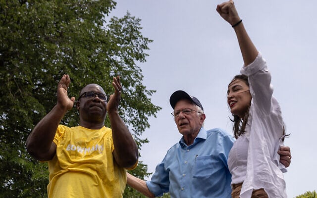 US Representative Alexandria Ocasio-Cortez (L), Democrat of New York; US Independent Senator Bernie Sanders (C) from Vermont and US Representative Jamaal Bowman, Democrat of New York, attend a 'Get Out The Vote' rally on the weekend before the Democratic Primary in New York, June 22, 2024. (Yuki IWAMURA / AFP) US Representative Alexandria Ocasio-Cortez (L), Democrat of New York; US Independent Senator Bernie Sanders (C) from Vermont and US Representative Jamaal Bowman, Democrat of New York, attend a 'Get Out The Vote' rally on the weekend before the Democratic Primary in New York, June 22, 2024. (Yuki IWAMURA / AFP)