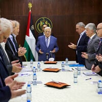Palestinian Authority President Mahmoud Abbas (C) recites a prayer during a meeting with members of the executive committee of the Palestine Liberation Organisation (PLO) in the West Bank city of Ramallah on June 24, 2024. (Thaer Ghanaim / PPO / AFP)