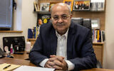 Arab-Israeli parliament member Ahmad Tibi poses for a picture during an interview with AFP at his office at the Knesset  in Jerusalem, June 25, 2024. (Menahem Kahana / AFP)