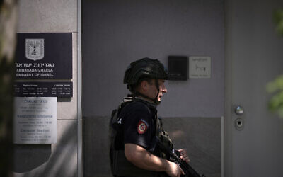 A Serbian police officer is stationed outside the entrance to Israel's embassy in Belgrade, June 29, 2024. (Oliver Bunic/AFP)