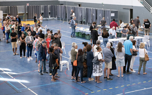 People queue in front of polling stations inside the Anse Vata sports hall to vote in the first round of France's crunch legislative elections in Noumea, in France's Pacific territory of New Caledonia, on June 30, 2024. (Photo by Delphine MAYEUR / AFP) People queue in front of polling stations inside the Anse Vata sports hall to vote in the first round of France's crunch legislative elections in Noumea, in France's Pacific territory of New Caledonia, on June 30, 2024. (Photo by Delphine MAYEUR / AFP)