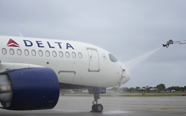 An Airbus A220 is sprayed as part of deicing training for Delta Air Lines employees in preparation for winter weather at Minneapolis-St. Paul airport, September 6, 2023. (AP/Abbie Parr)