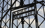 The entrance gate of the former Nazi concentration camp in Dachau near Munich, southern Germany, with the slogan reading "Works brings you freedom", on Friday, April 24, 2009. (AP Photo/Christof Stache, File)