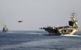 The aircraft carrier USS Dwight D. Eisenhower and other warships crosses the Strait of Hormuz into the Persian Gulf on November 26, 2023. (Information Technician Second Class Ruskin Naval/US Navy via AP)