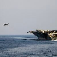 The aircraft carrier USS Dwight D. Eisenhower and other warships crosses the Strait of Hormuz into the Persian Gulf on November 26, 2023. (Information Technician Second Class Ruskin Naval/US Navy via AP)
