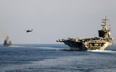 The aircraft carrier USS Dwight D. Eisenhower and other warships crosses the Strait of Hormuz into the Persian Gulf on November 26, 2023. (Information Technician Second Class Ruskin Naval/US Navy via AP)