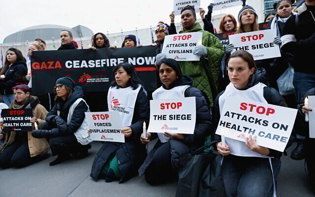 Doctors Without Borders staff gather at UN headquarters in New York to protest Israel's actions in Gaza, December 6, 2023, in New York. (Sara Kerens/AP Images for Doctors Without Borders)