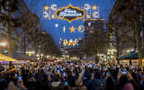 A 'Happy Ramadan' sign is illuminated on the occasion of the beginning of the month of Ramadan in a pedestrian zone in Frankfurt, Germany, March 10, 2024. (AP Photo/ Michael Probst)