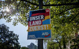 An AfD election poster for the European elections reading "our country first" is fixed on a pole in Frankfurt, Germany, Monday, May 13, 2024. (AP Photo/Michael Probst)