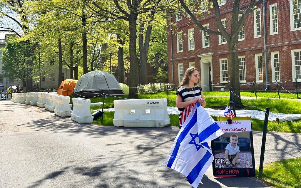 An alumnus of Harvard University stands near an anti-Israel encampment set up at the university, in Cambridge, Massachusetts, May 14, 2024. (Michael Casey/AP) An alumnus of Harvard University stands near an anti-Israel encampment set up at the university, in Cambridge, Massachusetts, May 14, 2024. (Michael Casey/AP)