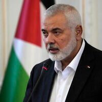 Hamas chief Ismail Haniyeh speaks during a press briefing after his meeting with Iranian Foreign Minister Hossein Amirabdollahian in Tehran, Iran, March 26, 2024. (AP Photo/Vahid Salemi)
