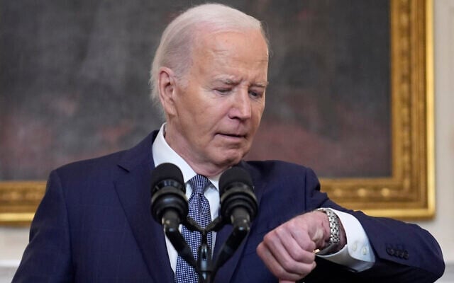 US President Joe Biden checks his watch before delivering remarks on the Middle East, from the State Dining Room of the White House, May 31, 2024, in Washington. (AP Photo/Evan Vucci) US President Joe Biden checks his watch before delivering remarks on the Middle East, from the State Dining Room of the White House, May 31, 2024, in Washington. (AP Photo/Evan Vucci)