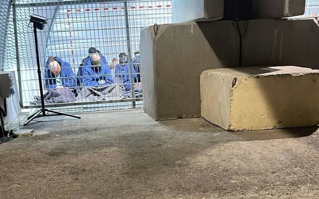Blindfolded Palestinians captured in the Gaza Strip in a detention facility on the Sde Teiman military base in southern Israel, in 2024. (Breaking The Silence via AP)