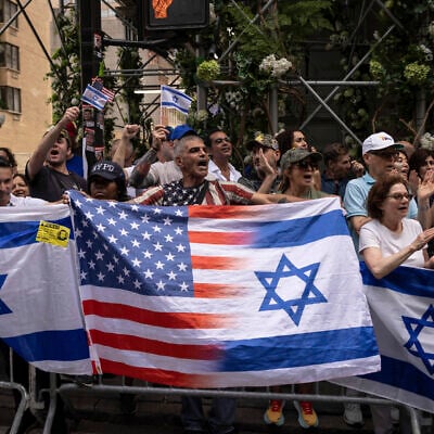 People holding Israeli flags gather for the annual Israel Day Parade on Fifth Avenue on June 2, 2024, in New York. (AP Photo/Yuki Iwamura)