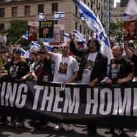Family members of Israeli hostages march during the annual Israel Day Parade on Fifth Avenue on June 2, 2024, in New York. (AP Photo/Yuki Iwamura)