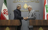 Iranian interim Foreign Minister Ali Bagheri Kani, left, shakes hands with Lebanese Foreign Minister Abdallah Bou Habib, after their news conference in Beirut, Lebanon, Monday, June 3, 2024. Kani arrived in Lebanon Monday, his first official diplomatic visit since his predecessor died in a helicopter crash last month. (AP Photo/Hassan Ammar)