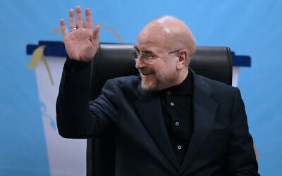 Iran's hardline parliament speaker, Mohammad Bagher Qalibaf waves to the media while registering his name as candidate for the June 28 presidential election at the Interior Ministry, in Tehran, Iran, June 3, 2024. (AP Photo/Vahid Salemi)