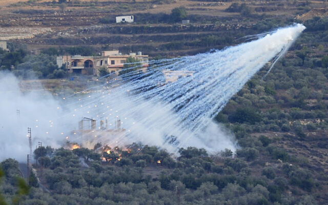 An Israeli artillery shell explodes over a house in al-Bustan, a Lebanese village along the border with Israel, on October 15, 2023. (AP Photo/Hussein Malla) An Israeli artillery shell explodes over a house in al-Bustan, a Lebanese village along the border with Israel, on October 15, 2023. (AP Photo/Hussein Malla)