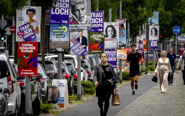 People walk past elections posters for the European elections in Frankfurt, Germany, June 6, 2024. (AP Photo/Michael Probst) People walk past elections posters for the European elections in Frankfurt, Germany, June 6, 2024. (AP Photo/Michael Probst)