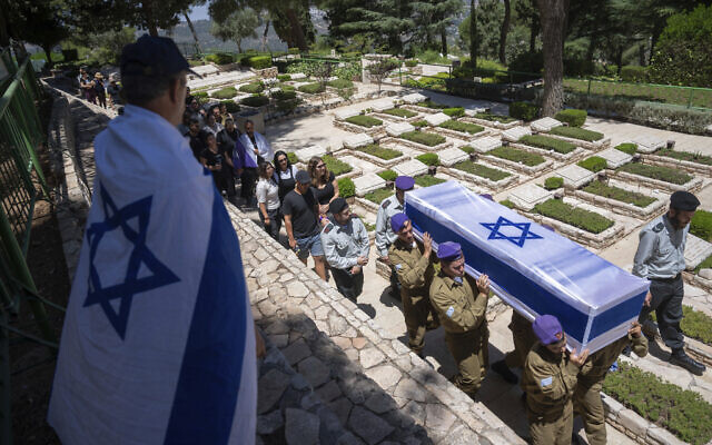 The coffin of Sgt. Almog Shalom, 19, who was killed in battle in the Gaza Strip, is carried during his funeral at the Mount Herzl military cemetery in Jerusalem, June 11, 2024. (AP Photo/Ohad Zwigenberg) The coffin of Sgt. Almog Shalom, 19, who was killed in battle in the Gaza Strip, is carried during his funeral at the Mount Herzl military cemetery in Jerusalem, June 11, 2024. (AP Photo/Ohad Zwigenberg)
