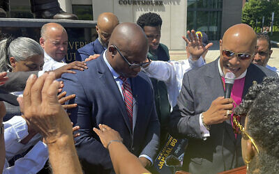 Religious leaders place their hands on Rep. Jamaal Bowman, Democrat of New York, while praying for him during a campaign stop in White Plains, New York, June 11, 2024. (AP/Ted Shaffrey)