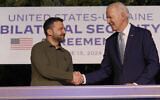US President Joe Biden and Ukrainian President Volodymyr Zelensky, left, shake hands after signing a security agreement on the sidelines of the G7, June 13, 2024, in Savelletri, Italy. (AP/Alex Brandon)