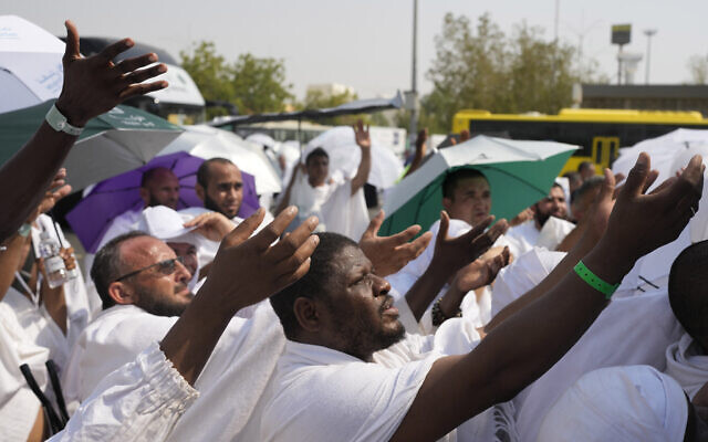 Muslim pilgrims try to reach for free drinking water in Arafat, on the second day of the annual hajj pilgrimage, near the holy city of Mecca, Saudi Arabia, June 15, 2024. (AP Photo/Rafiq Maqbool) Muslim pilgrims try to reach for free drinking water in Arafat, on the second day of the annual hajj pilgrimage, near the holy city of Mecca, Saudi Arabia, June 15, 2024. (AP Photo/Rafiq Maqbool)