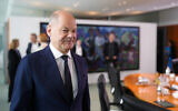 German Chancellor Olaf Scholz arrives for the cabinet meeting in the Chancellery in Berlin, Germany, June 19, 2024. (AP Photo/Markus Schreiber)