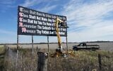 File: Workers repaint a Ten Commandments billboard off of Interstate 71 on Election Day near Chenoweth, Ohio, November 7, 2023. (AP Photo/Carolyn Kaster)