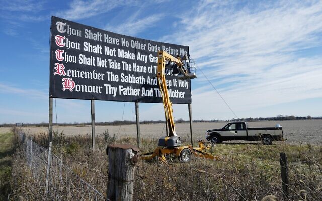 File: Workers repaint a Ten Commandments billboard off of Interstate 71 on Election Day near Chenoweth, Ohio, November 7, 2023. (AP Photo/Carolyn Kaster) File: Workers repaint a Ten Commandments billboard off of Interstate 71 on Election Day near Chenoweth, Ohio, November 7, 2023. (AP Photo/Carolyn Kaster)