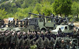 FILE - Fighters from the Lebanese terror group Hezbollah carry out a training exercise in Aaramta village in the Jezzine District, southern Lebanon, May 21, 2023 (AP Photo/Hassan Ammar, File)