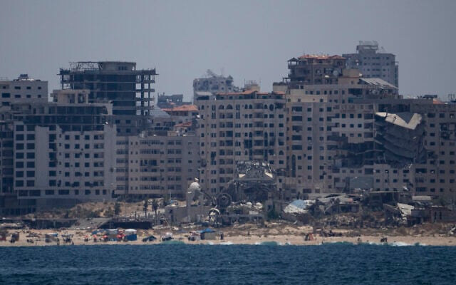 Destroyed buildings stand in the coast of the Gaza Strip as seen from the Mediterranean Sea, Tuesday, June 25, 2024. (AP Photo/Leo Correa)