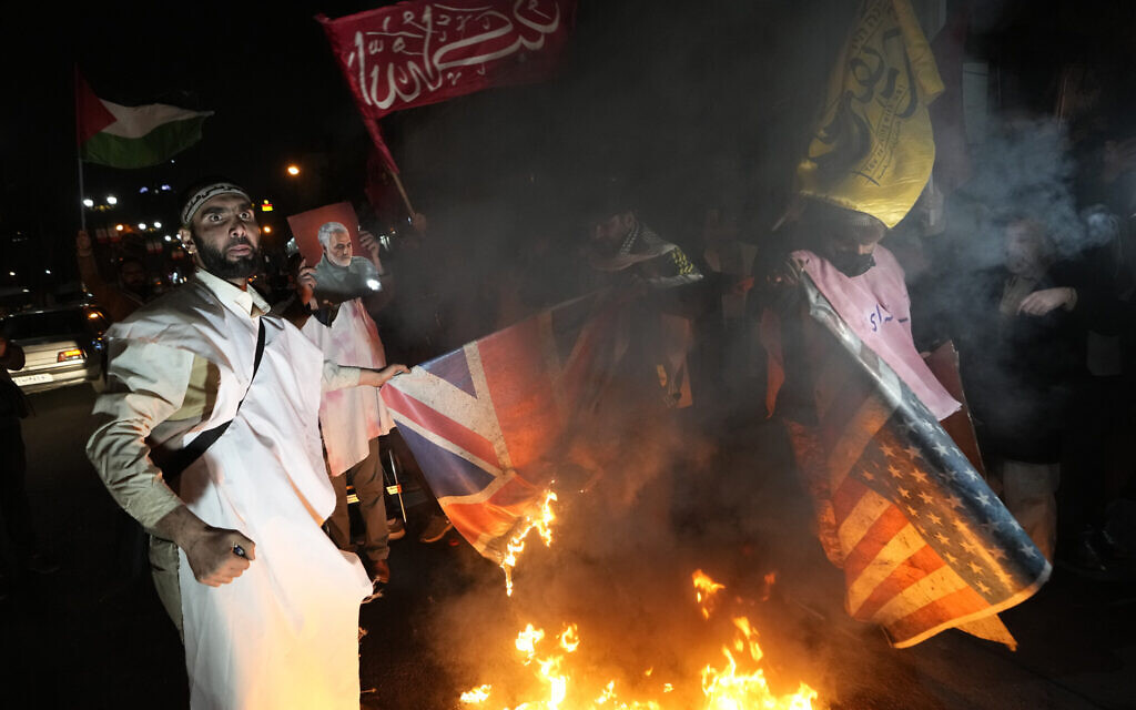 Iranian demonstrators burn representations of British and US flags during a protest against the US and British military strike against Iranian-backed Houthis in Yemen, in front of the British Embassy in Tehran, Iran, January 12, 2024. (AP Photo/Vahid Salemi, File) Iranian demonstrators burn representations of British and US flags during a protest against the US and British military strike against Iranian-backed Houthis in Yemen, in front of the British Embassy in Tehran, Iran, January 12, 2024. (AP Photo/Vahid Salemi, File)