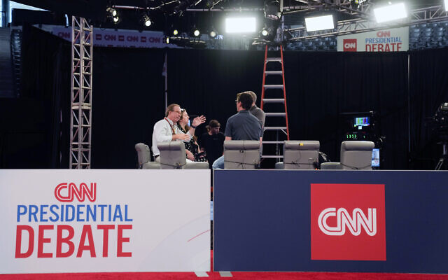 People converse during setup in the spin room for the upcoming CNN Presidential Debate between President Joe Biden and Republican presidential candidate former President Donald Trump in Atlanta, Wednesday, June 26, 2024. (AP/Gerald Herbert)
