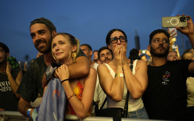 Participants at the Nova Healing Concert in Tel Aviv, Israel, on Thursday, June 27, 2024. This was the first Tribe of Nova mass gathering since the Oct. 7, 2023 cross-border attack by Hamas terrorists who killed hundreds at the Nova music festival and kidnapped others to Gaza. (AP Photo/Ohad Zwigenberg)