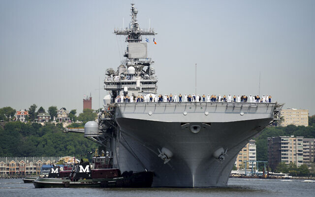 Sailors and military service personnel arrive on the USS Wasp amphibious assault ship on the Hudson River during fleet week, May 24, 2023, in New York. (AP Photo/John Minchillo, FIle)