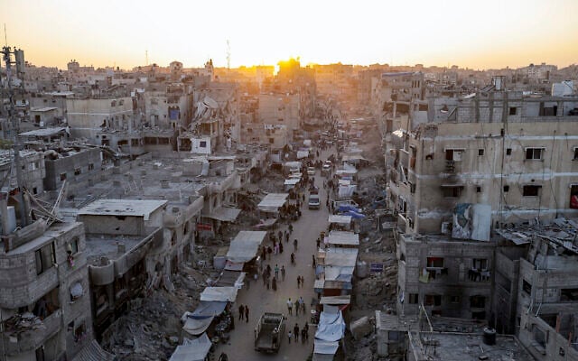 Palestinians walk through a street market in Khan Younis, southern Gaza Strip, June 29, 2024. (AP Photo/Jehad Alshrafi)