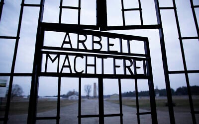 This January 27, 2012, file photo taken on International Holocaust Remembrance Day shows the words 'Arbeit Macht Frei' (Work Sets You Free) marking the entrance to the Sachsenhausen Nazi concentration, in Oranienburg, Germany. (AP Photo/Markus Schreiber, File)