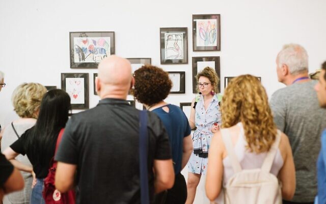 Visitors on a tour during the 2023 Fresh Paint art fair. (Courtesy)