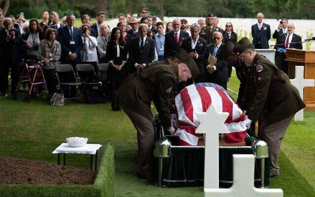 US soldiers carry the coffin of 1st. Lt. Nathan B. Baskind, who was buried in a German mass grave after being killed in WWII and recently reburied after DNA testing proved his identity, in Normandy, France, June 23, 2024. (Benjamin Mack-Jackson)