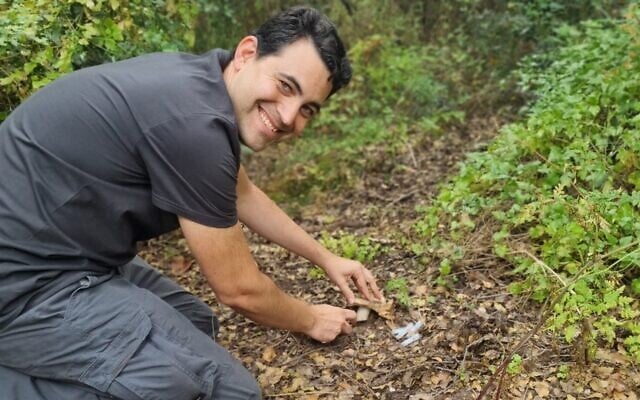 Elad Gilon finds a Russell species of fungi. He is doing research to determine if it is edible. (Emmanuel Sarid)