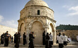Franciscan friars and sisters pray during a mass for the Feast of the Ascension on The Rock of the Ascension at  The Chapel of the Ascension in Jerusalem on May 20, 2020. The Feast of the Ascension commemorates the Christian belief of the bodily Ascension of Jesus into heaven. (Olivier Fitoussi/Flash90)