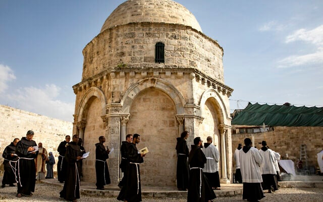 Franciscan friars and sisters pray during a mass for the Feast of the Ascension on The Rock of the Ascension at The Chapel of the Ascension in Jerusalem on May 20, 2020. The Feast of the Ascension commemorates the Christian belief of the bodily Ascension of Jesus into heaven. (Olivier Fitoussi/Flash90) Franciscan friars and sisters pray during a mass for the Feast of the Ascension on The Rock of the Ascension at The Chapel of the Ascension in Jerusalem on May 20, 2020. The Feast of the Ascension commemorates the Christian belief of the bodily Ascension of Jesus into heaven. (Olivier Fitoussi/Flash90)