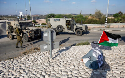 Illustrative: Israeli soldiers guard near Qalqilya on August 12, 2022. (Nasser Ishtayeh/Flash90)