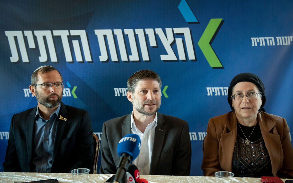 Finance Minister Bezalel Smotrich, center, Settlements and National Projects Minister Orit Strock, right, and Israel Gantz, head of the Binyamin Regional Council, attend a Religious Zionism faction meeting in the West Bank settlement of Givat Harel, February 14, 2023. (Sraya Diamant/Flash90)