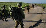 Illustrative: IDF infantry reservists take part in a military maneuver in the Golan Heights, on April 1, 2024. (Michael Giladi/ Flash90)