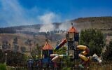 Illustrative: View of a large fire caused from rockets fired from Lebanon, outside the northern Israeli town of Kiryat Shmona, June 1, 2024. (Ayal Margolin/Flash90)