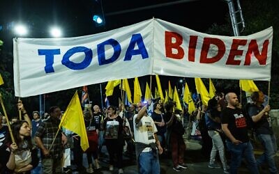 Protesters hold large banner reading "Thank you, Biden," during a march in support of a hostage deal in Jerusalem on June 1, 2024. (Yonatan Sindel/Flash90)