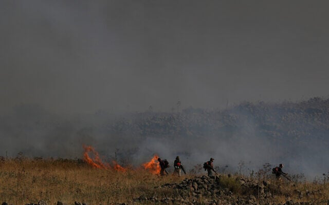 View of a large fire caused from rockets fired from Lebanon, near the northern town of Katzrin, June 2, 2024. (Ayal Margolin/Flash90 View of a large fire caused from rockets fired from Lebanon, near the northern town of Katzrin, June 2, 2024. (Ayal Margolin/Flash90