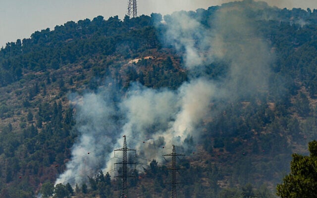 View of a large fire caused from rockets fired from Lebanon, near the northern city of Kiryat Shmona, June 4, 2024. (Ayal Margolin/Flash90) View of a large fire caused from rockets fired from Lebanon, near the northern city of Kiryat Shmona, June 4, 2024. (Ayal Margolin/Flash90)